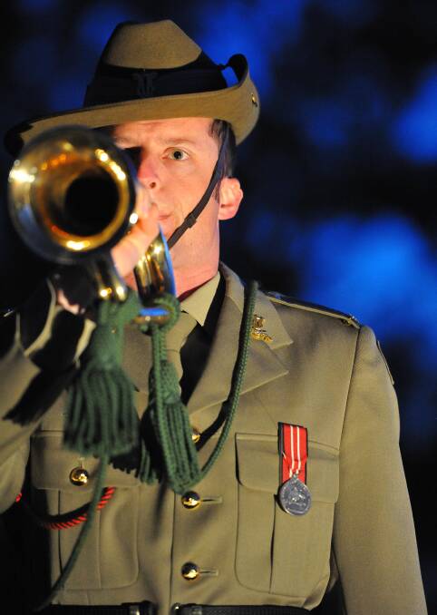 Dawn service at Kapooka. Musician Kaid Normington plays The Last Post. Picture: Kieren L Tilly