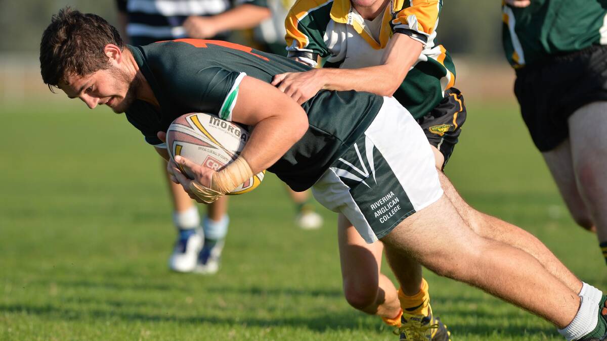 March 31. The Riverina Anglican College v Mount Austin. TRAC's Joe McNamara goes in for a try despite the efforts of Mt Austin's fullback Nathan Cook. Picture: Michael Frogley 