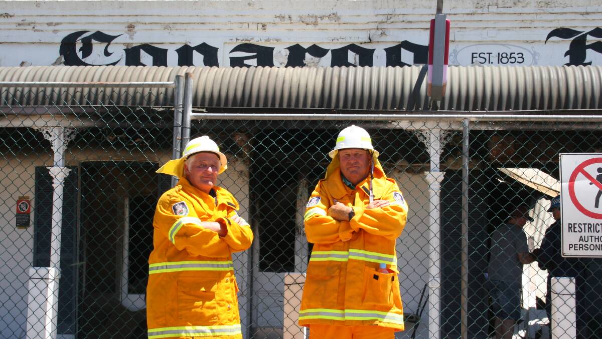 HELPING HANDS: RFS volunteer Alan Hardcastle and chairman of the Conargo Fire Brigade Colin Bull were among the first on the scene on Tuesday night and said what they were confronted with rivalled any fires they had seen in their careers. Picture: Nicole Barlow 