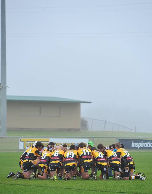 IN MEMORIAM: The boys of the Gundagai Tigers Under 16s rugby league side pay tribute to Lui before the game. (Photo: Kieran L Tilly)