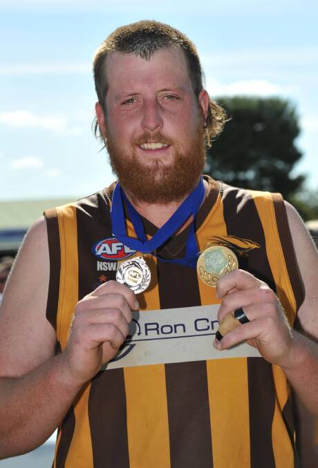 UNSTOPPABLE:  East Wagga-Kooringal ruckman Jordon Wood shows off his two medals, one for the premiership win and the other for best-on-ground in the reserve grade grand final.
