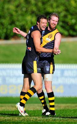 KEY SIGNING: Ryan Quade (right) celebrates a goal with Queanbeyan team mate James Kavanagh in a recent North Eastern Australian Football League (NEAFL) game. Quade has signed with Hume League club Henty.
