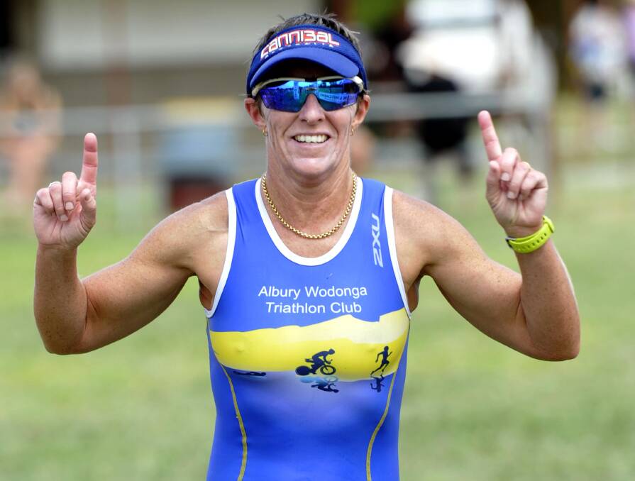 NUMBER ONE: Albury triathlete Julie Gollan-Foard crosses the line to win the women's division of the Ganmain triathlon on Sunday. Picture: Les Smith