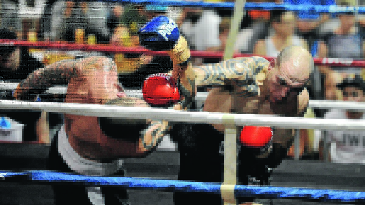 HIT PARADE: Wagga boxer Anthony McCracken catches Kurtis Pegoraro with a fearsome right hand in their fight at Bolton Park stadium on Saturday.
