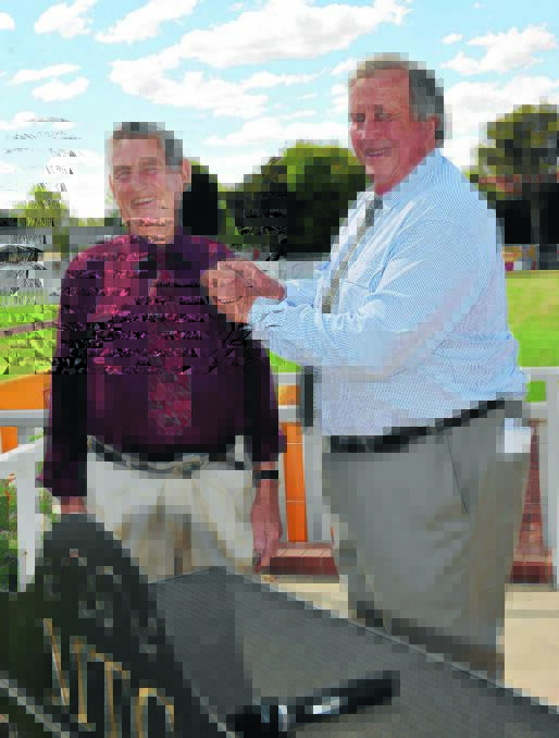 WILL BE MISSED: The late Bob Vaughan (left) is presented Southern District Racing Association (SDRA) life membership by president David Wallace at Murrumbidgee Turf Club last year. Vaughan passed away this week, aged 79.