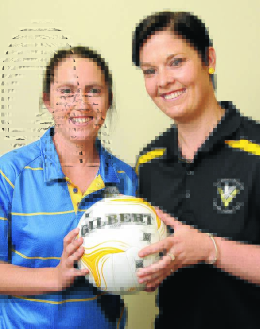 READY TO RUMBLE: Mangoplah-Cookardinia United-Eastlakes first-year player Shea Byrne and Narrandera goal shooter Caren Hugo prepare for Sunday's Riverina A grade netball grand final at Narrandera. Picture: Kieren L Tilly