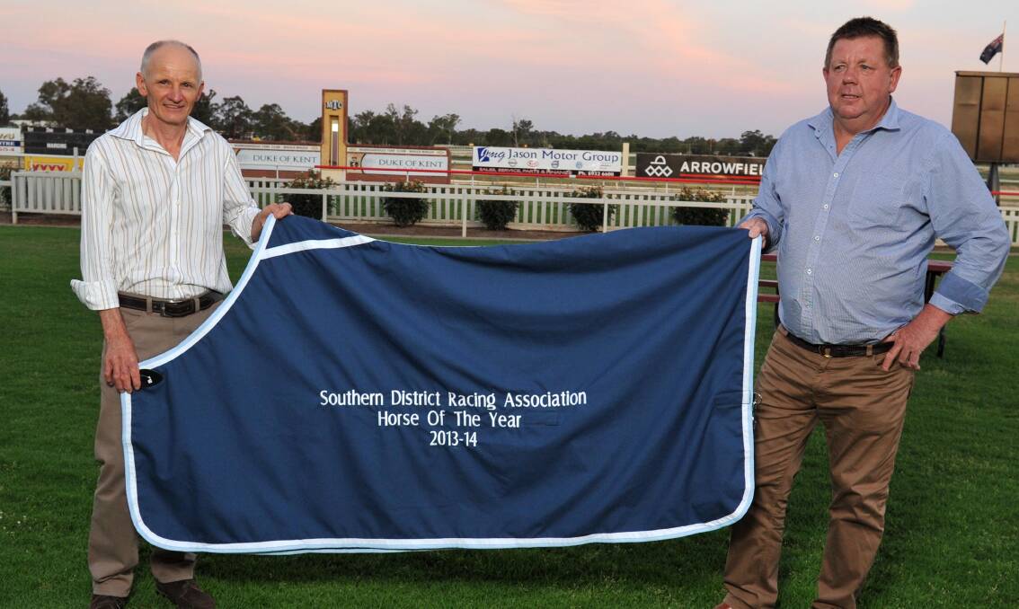 JOINT WINNERS: Wagga trainer Tim Donnelly and Albury trainer Brett Cavanough show off the SDRA Horse of the Year rug after Jo Jo Girl and The Monstar could not be split for the top award. Picture: Michael Frogley