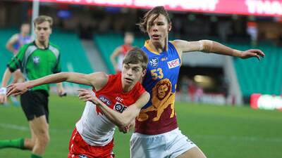 BIG TASK: Jackson Kelly competes against a much bigger Brisbane Lions opponent in the North Eastern Australian Football League (NEAFL) game for the Sydney Swans reserve grade team at the Sydney Cricket Ground on Friday.