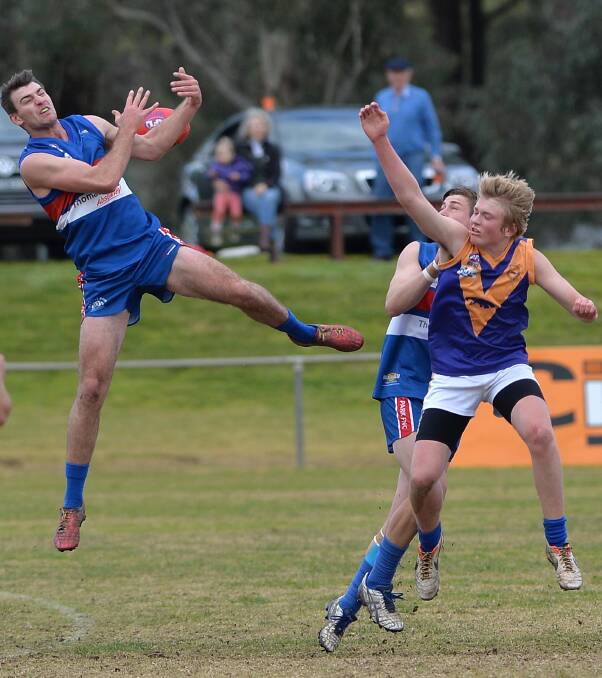 HIGH FLYER: Turvey Park's Hayden Ashcroft flies high over Narrandera's Daniel Smith in the Riverina Football League game at Maher Oval on Saturday. Picture: Michael Frogley