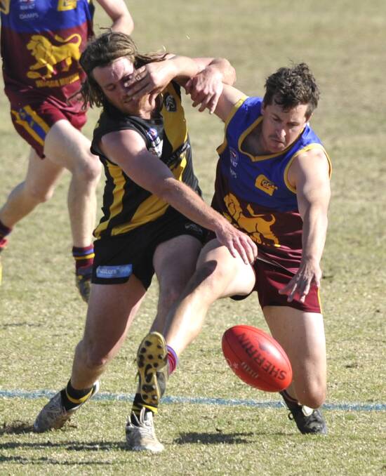 FIERCE BATTLE: Ganmain-Grong Grong-Matong's Ash Dikkenberg contests for the ball against Wagga Tigers defender Ben Davis in the Riverina Football League elimination final at Narrandera Sportsground on Sunday. Picture: Les Smith