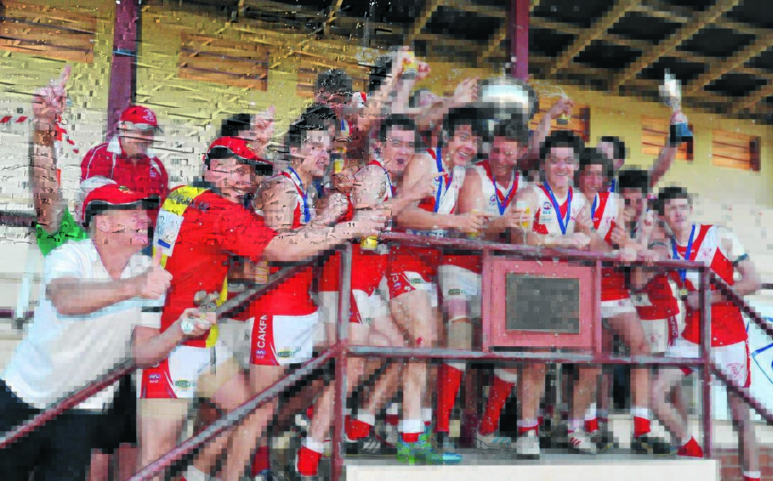 PARTY TIME: Collingullie-Ashmont-Kapooka celebrates its first Riverina Football League grand final after a 13-point win over Mangoplah-Cookardinia United-Eastlakes at Narrandera Sportsground yesterday. Picture: Laura Hardwick