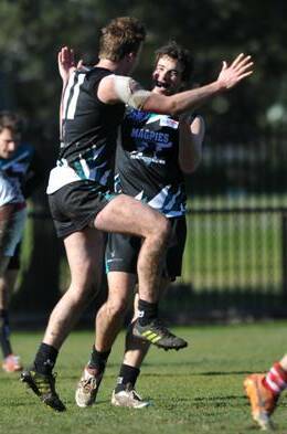 HAPPY DAYS: Belconnen's Alexander Bennett and Tom Alexander celebrate a goal in the game against Eastlake earlier this year. Belconnen has contacted AFL Riverina about a potential move to the Riverina Football League. Picture: The Canberra Times