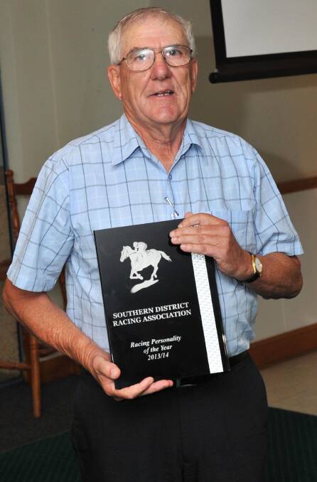 WELL DESERVED: Gundagai's Len Tozer accepts the Southern District Racing Association (SDRA) Personality of the Year award for 2013-14. Picture: Michael Frogley