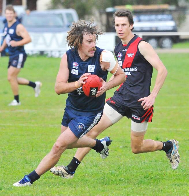 WIDE AWAKE: Coleambally midfielder Drew Kenna eludes Marrar's Josh Habel in a Farrer League game this season. Kenna believes Coleambally can go all the way in finals, despite a big loss to East Wagga-Kooringal last weekend. Picture: Kieren L Tilly