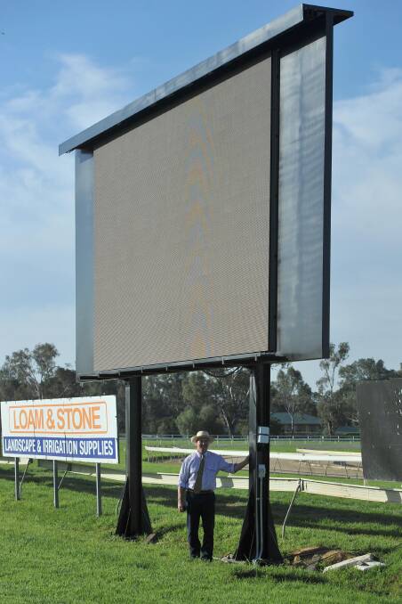 BIG SCREEN: Murrumbidgee Turf Club president Stuart Lamont shows off the new big screen that will reside permanently at the track. Picture: Laura Hardwick