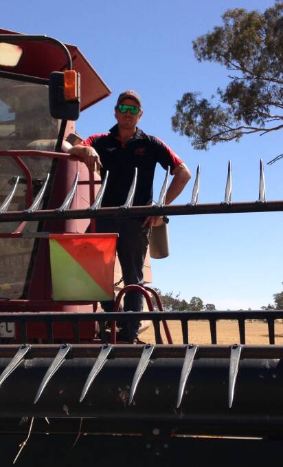BACK AT THE BOMBERS: Marrar recruit Josh Hagar takes a break from harvest yesterday to show off his new colours.