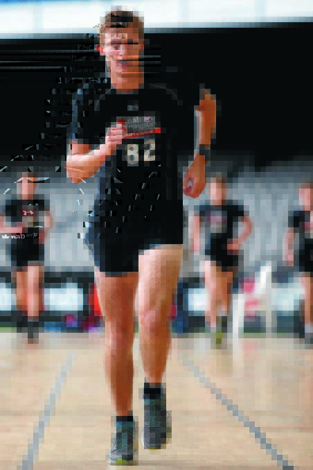 POWERING AHEAD: Wagga teenager Dougal Howard runs in the beep test during day four of the 2014 NAB AFL Draft Combine at Etihad Stadium, Melbourne, in October. Picture: AFL Media