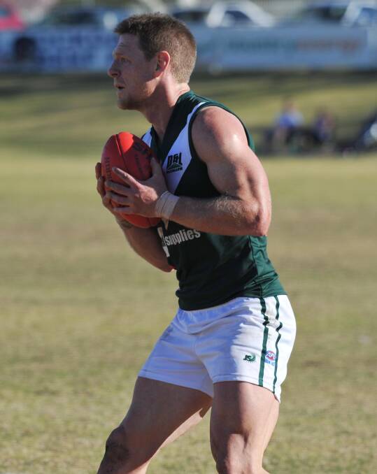 UPBEAT: Coolamon coach Lew Roberts takes a mark in the Riverina Football League qualifying final loss on Saturday. Picture: Laura Hardwick