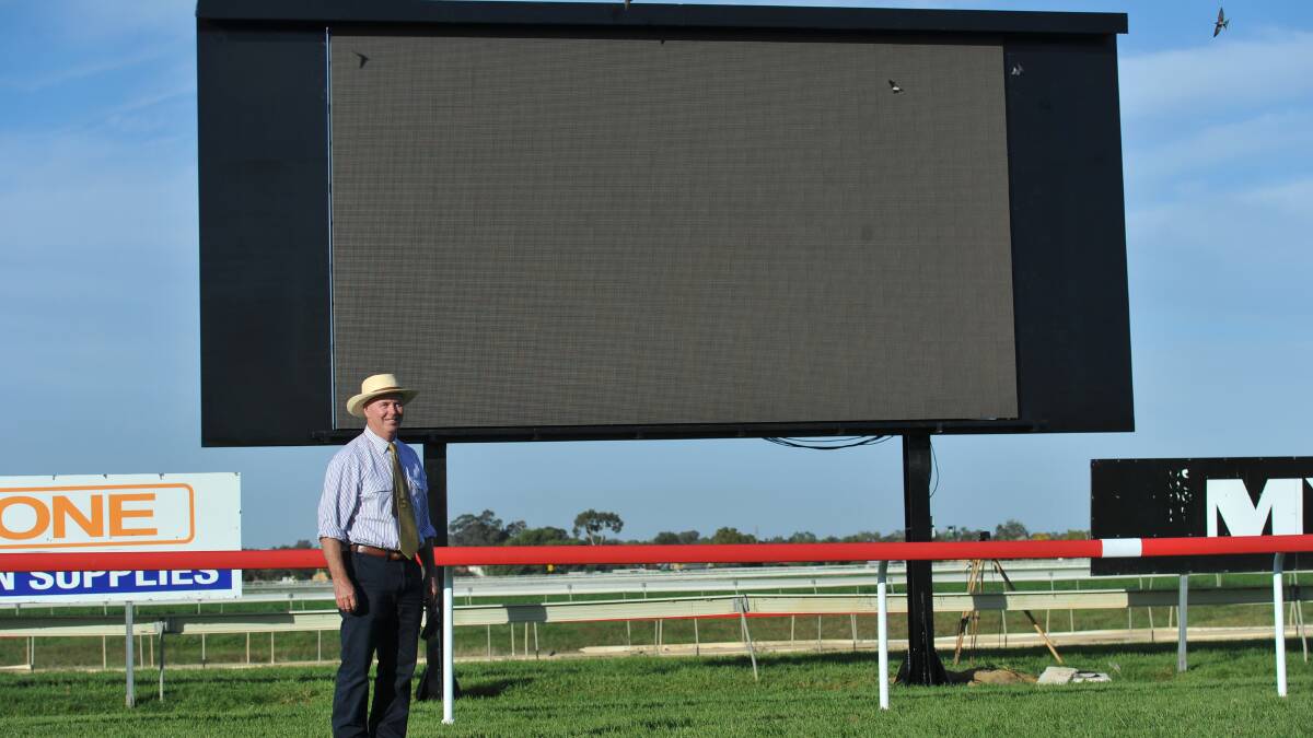 BIG SCREEN: Murrumbidgee Turf Club president Stuart Lamont shows off the new big screen that will reside permanently at the track. Picture: Laura Hardwick