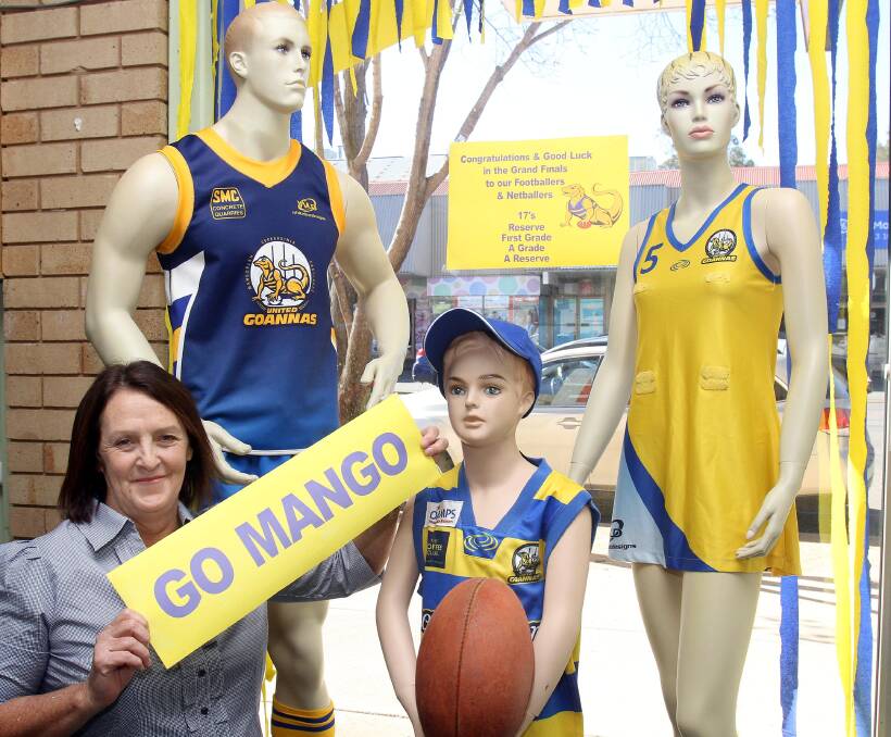 MOMENT OF TRUTH: Mangoplah-Cookardinia United-Eastlakes supporter Sharon Dew shows off the shop window of Creative Embroidery & Work Wear in Wagga ahead of Sunday's Riverina Football League grand final day. Picture: Kieren L Tilly