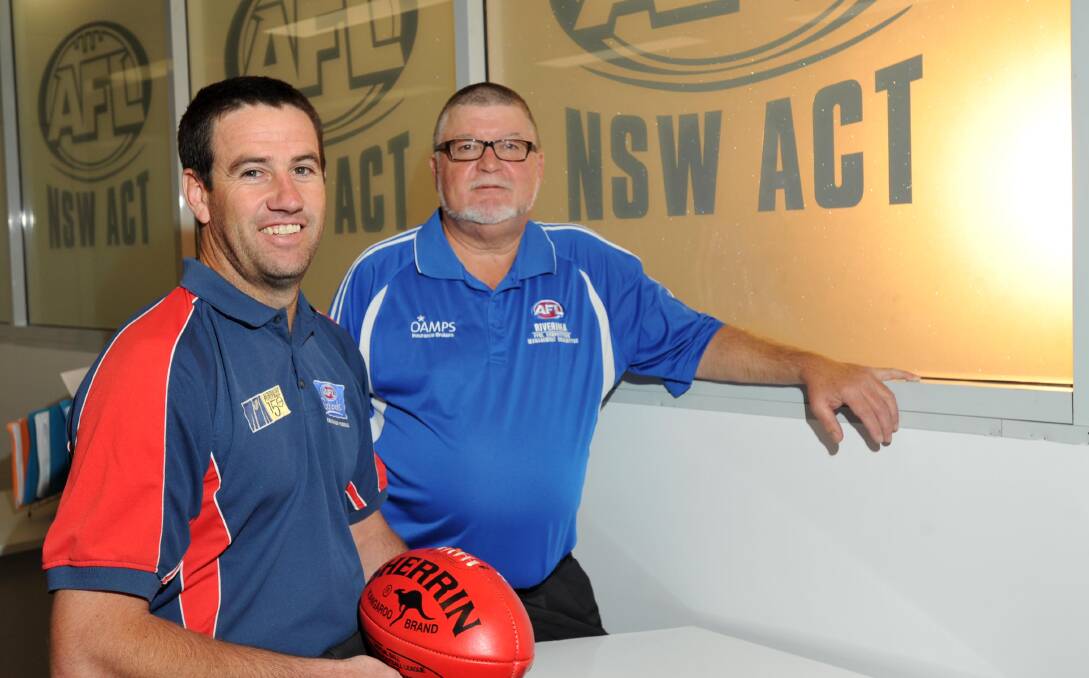 NEW ERA: New Farrer League representative coach Jason McPherson discusses the team with Farrer League president David Oehm at AFL House in Wagga on Thursday. Picture: Michael Frogley
