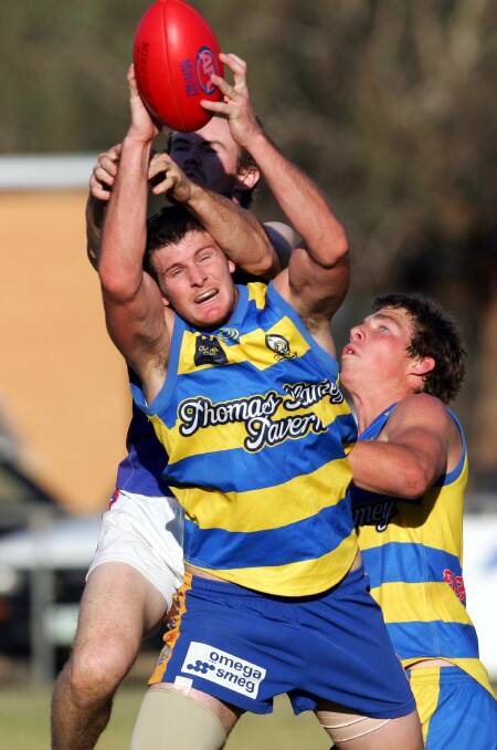 BACK IN BLUE AND GOLD: Sam Balding, pictured taking a pack mark, is one of three Charles Sturt University (CSU) players to make the late switch back to Mangoplah-Cookardinia United-Eastlakes for next season. Picture: Les Smith