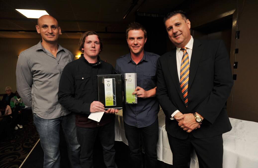 PAIR OF STARS: Flanked by former Eels star Michael Vella (left) and GWS Giants chief operating officer Richard Griffiths, Rules Club bowlers Isaac Rayner and Dave Ferguson savour the moment after winning the Senior Team gong at the Wagga Sports Awards at the Commercial Club. Picture: Laura Hardwick