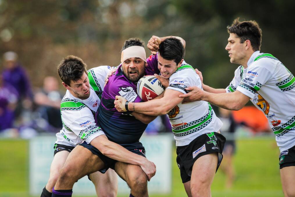 SURROUNDED: Southcity strongman Will Merritt is swarmed upon by Albury defenders at Greenfield Park on Sunday. Merritt scored the last-minutye try that gave the Bulls a 40-38 victory. Picture: The Border Mail