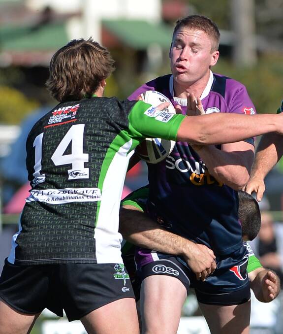 READY TO RUMBLE: Southcity star Nick Skinner (right) is tackled by Albury rival Josh Remington in the Group Nienmajor semi-final two weeks ago