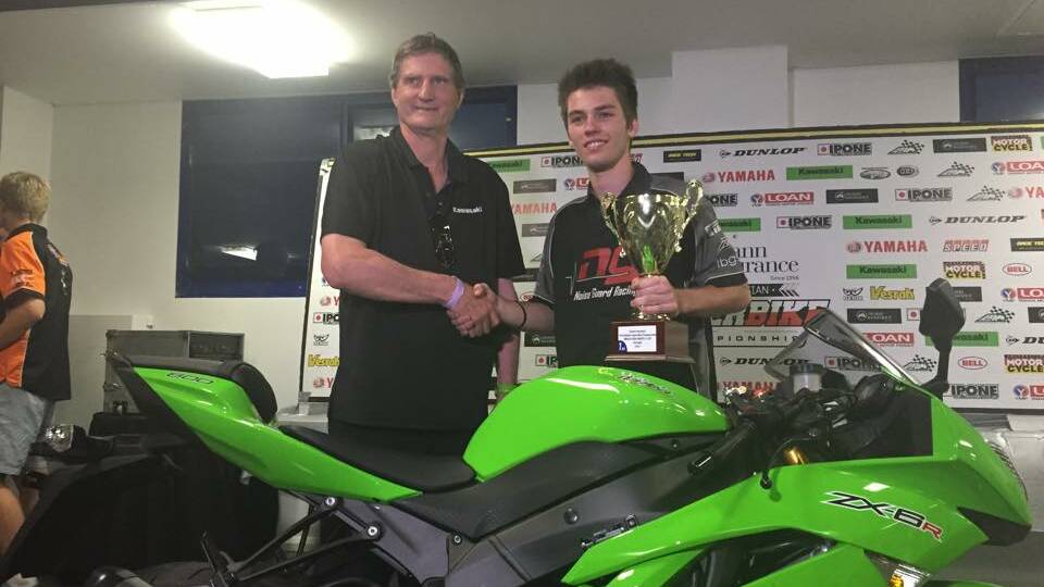 SWEET SUCCESS: Wagga teenager Brandon Demmery receives his trophy from Kawasaki Australia�s Murray Sayle in Sydney.