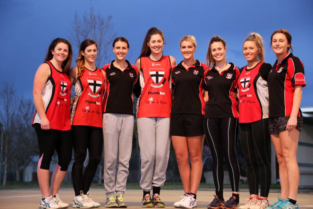 BOND OF FRIENDSHIP: Close mates (from left) Breanna Cross, Sarah Reardon, Emily O'Leary, Jordan Barret, Sarah O'Leary, Tayla Paterson, Brittany Fitzsimmons and Margie Johnson came together to play at North Wagga in the Farrer League A grade netball competition this year. The girls were all smiles at training this week.