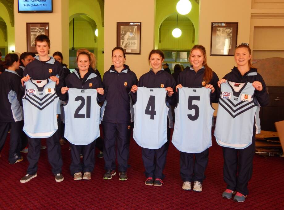 SPECIAL MOMENT: Displaying their NSW jumpers before the national championships are (from left) Ellie Dalgarno Fixter, Sarah Lloyd, Mel Hyland (coach), Veronica Kopecny, Lucy Raulston and Jamila Piercy (co-captain). The players were thrilled to receive their jumpers from Sydney Swans star Craig Bolton at the SCG