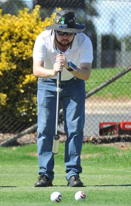 CONCENTRATION: Wagga's Josh Willsher is focused on a shot during the gate-ball tournament at Wagga Croquet Club. Picture: Michael Frogley