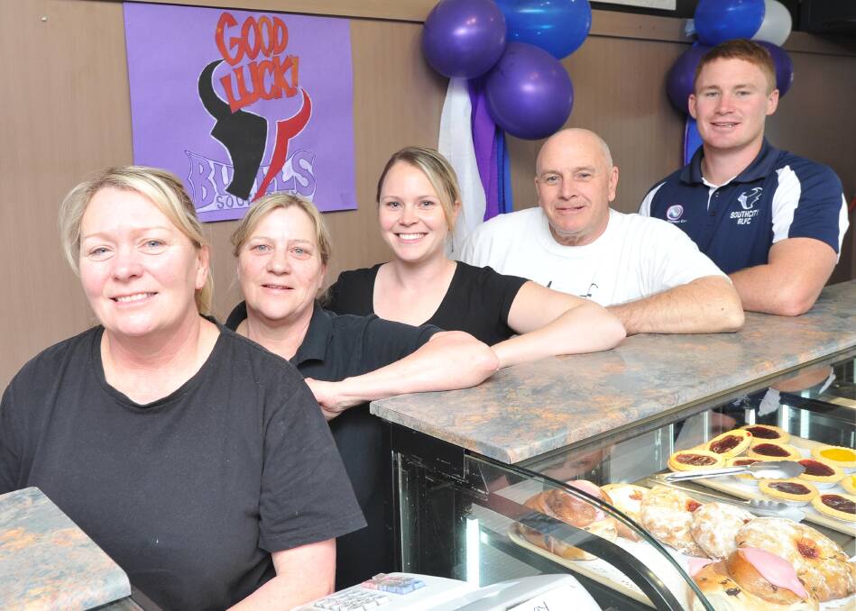FOOD FOR THOUGHT: Southcity star Nick Skinner (right) joined his mother Janette (left), and other Wagga Hot Bake staff Vicki O'Brien, Crystal Grentell and Peter O'Brien, to support the Bulls in the Group Nine grand final on Sunday