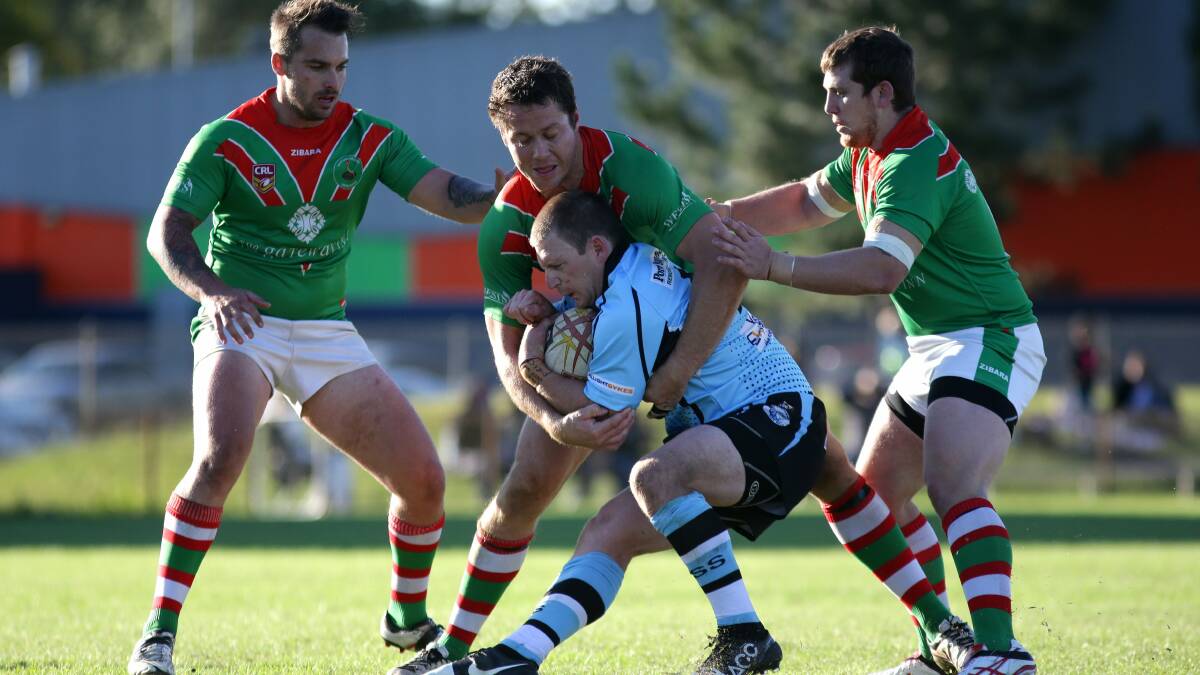 ACTION MAN: Kyle McCarthy (middle) playing for Port Stephens in the Newcastle domestic competition this year. Picture: The Newacstle Herald