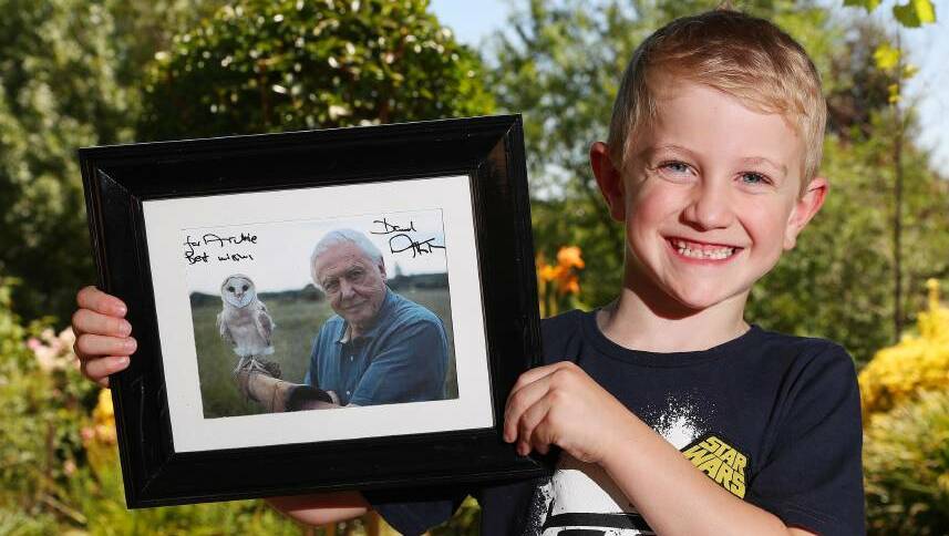 SUPER SMILER: Archie Comerford, 6, from Wagga, with his personally signed photograph from Sir David Attenborough. Picture: Kieren L Tilly.

