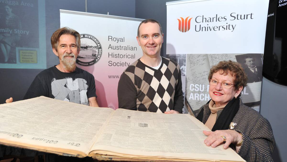 UNEXPLORED PAST: Royal Australian Historical Society vice-president Geoff Burch, CSU regional archives manager Wayne Doubleday and RAHS buff up on the region's multicultural history. Picture: Kieren L Tilly