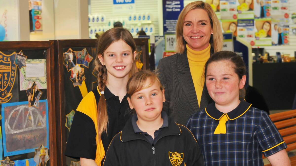 SUCCESSES OF SMALL SCHOOLS: Junee Public School principal Diana McGregor, students (back) Rachel Anderson, (front from left) Anna Skewes and Georgia Foley after their singing performance. Picture: Laura Hardwick