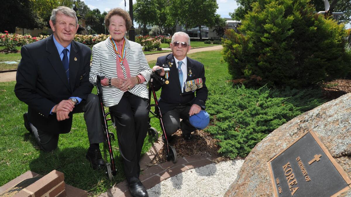 ReCOGNITION: Mitsue Stockley is presented with the peace medal by Korean War Veterans Association NSW regional representative Alan Evans and Wagga RSL sub-branch president Kevin Kerr. Picture: Michael Frogley