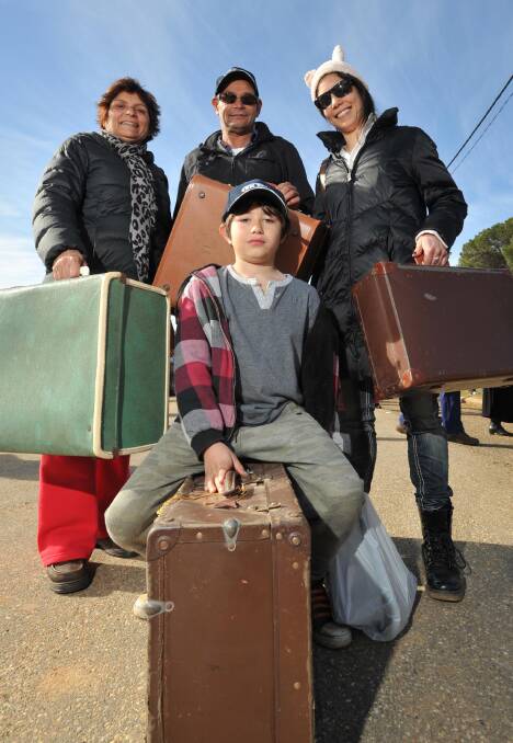 OLD TO NEW: The Halvelka family , from left, Janna, Jeff, Ella and Max, 9,were on a mission to find old suitcases to decorate the home. Picture: Michael Frogley