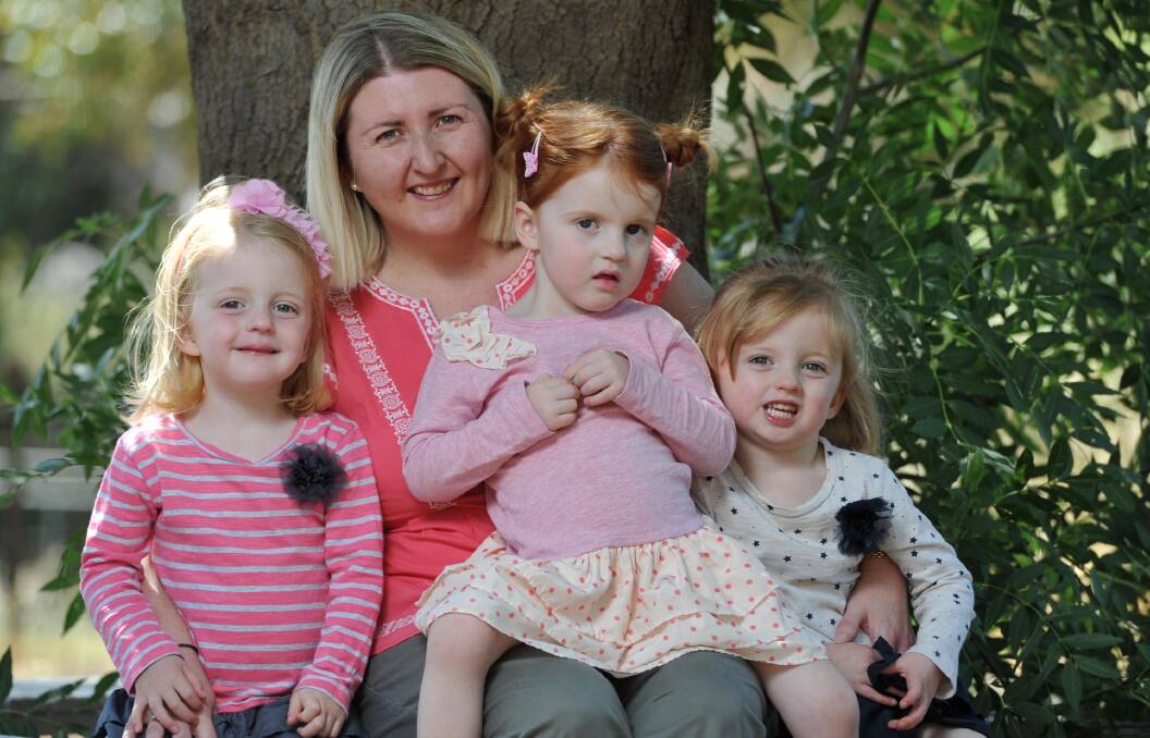 TRIPLE CHALLENGE: Nicole Dunn with her three-year-old triplets Isabella, Amelia and Grace. Picture: Michael Frogley