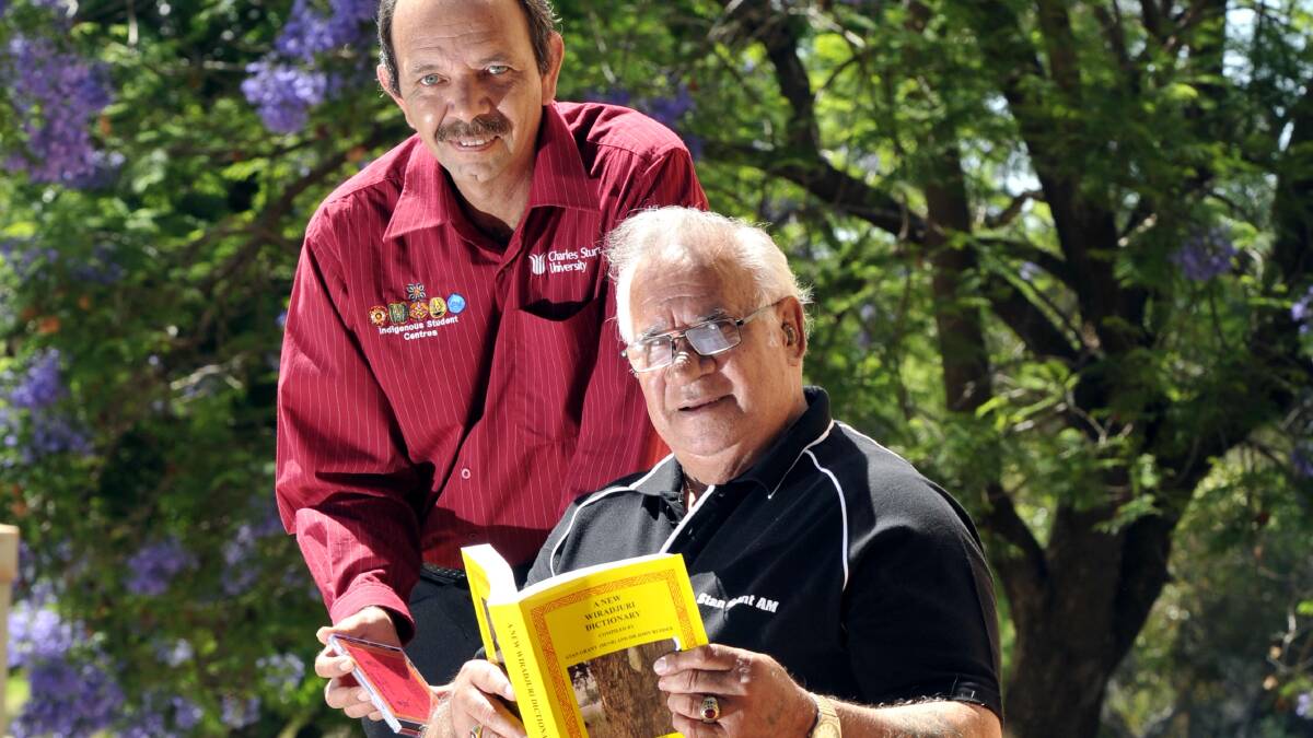 PRESERVING CULTURE: Charles Sturt University indigenous student centre manager Lloyd Dolan and New Wiradjuri Dictionary author Doctor Stan Grant celebrating the success of a new course designed to regenerate the Wiradjuri language. Picture: Les Smith