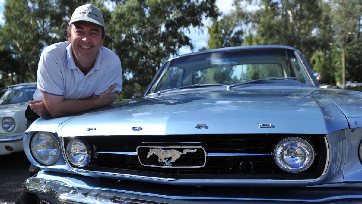 WILD RIDE: MOCA Riverina chapter co-ordinator Trevor Chapman stands will his '66 Mustang, which he bought last year. Picture: Laura Hardwick