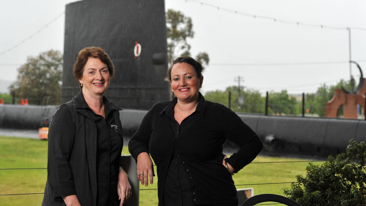 DOWN ON TRADE, BUT NO REGRETS: Submarine Cafe owner Helen Thompson, with employee Emily Garlick, does not lament the bypassing of Holbrook but says there has been a drop in visitors.