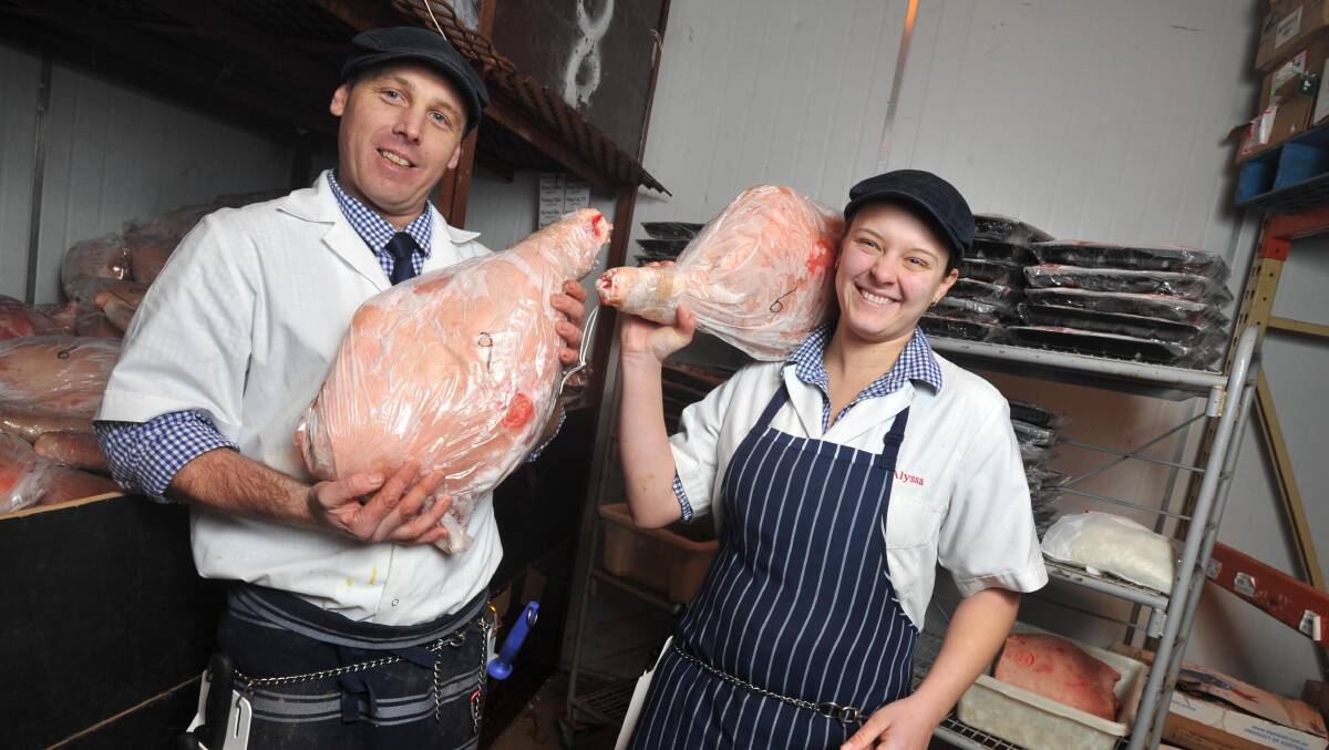 COLD DAYS AHEAD: Butcher Dane Vivian and apprentice butcher Alyssa Troy think the weather outside is balmy compared to the freezer room. Picture: Michael Frogley