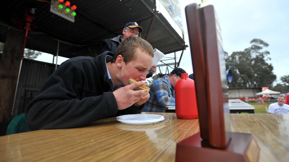 SHOW STAPLE: Gordy Power, of Jindabyne, chows down on a Ganmain Pie at last year's Ganmain Show.
