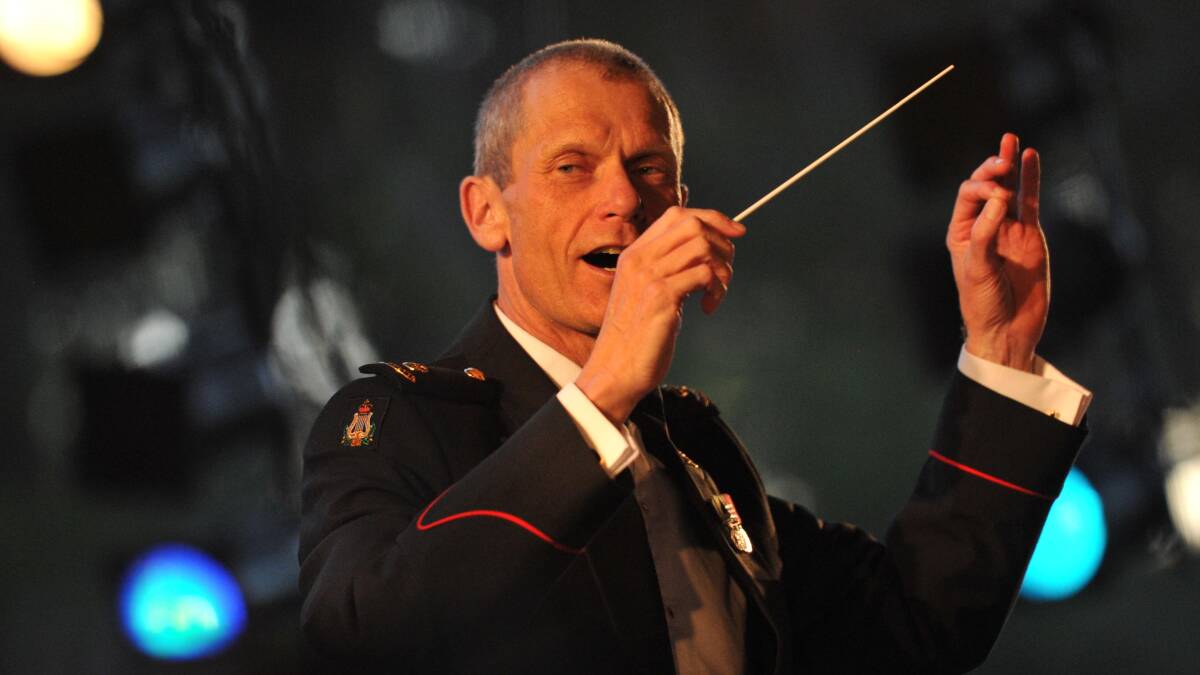 GOOD VIBES (left): Australian Army Band Kapooka conductor Major Peter Thomas on stage.