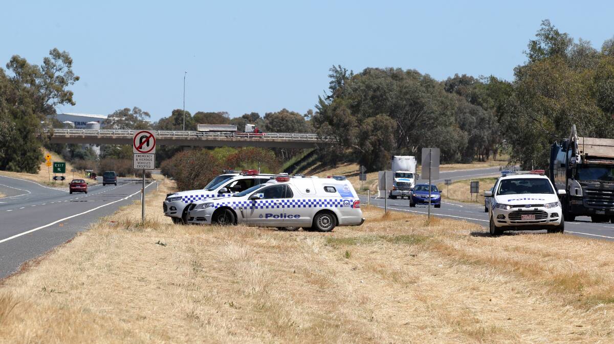 MANHUNT: Police near the Victorian border attempt to stop a gold Nissan X-Trail. Picture: Border Mail