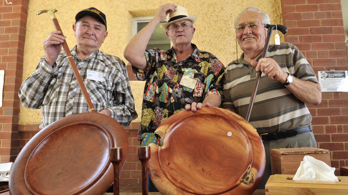 Riverina Woodworkers Club members John Piper, Ken Hoffman and Ross Hedt sell their wares at the CMRI Christmas Fair. Picture: Les Smith