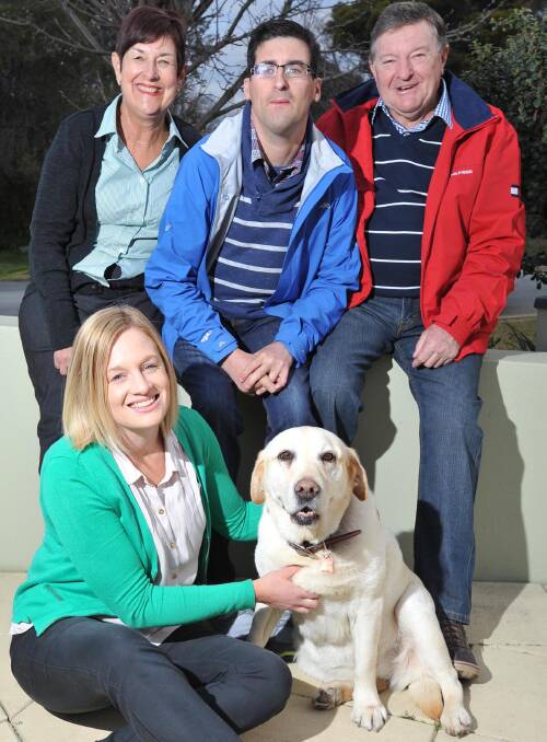 Jenni Morgan-Campbell with Juli, Ben and Paul Morgan are fund-raising for vital research into a rare chromosomal abnormality, with Cleo at their Wagga home. Picture: Laura Hardwick